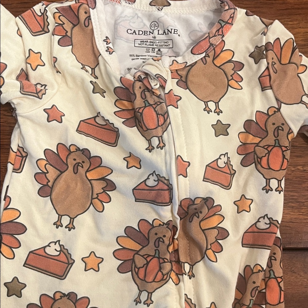 Caden Lane turkey Patterned Baby Outfit in Orange
